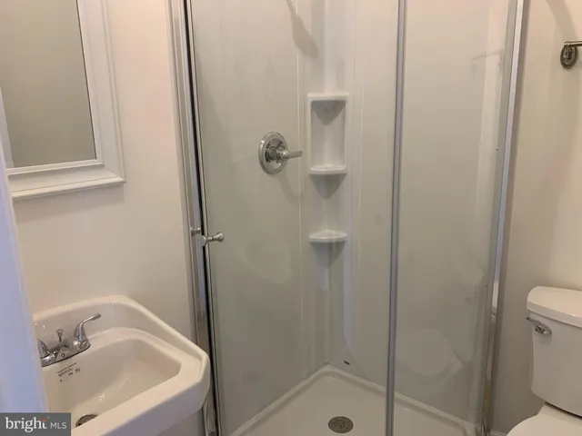 a bathroom with a tub and a sink