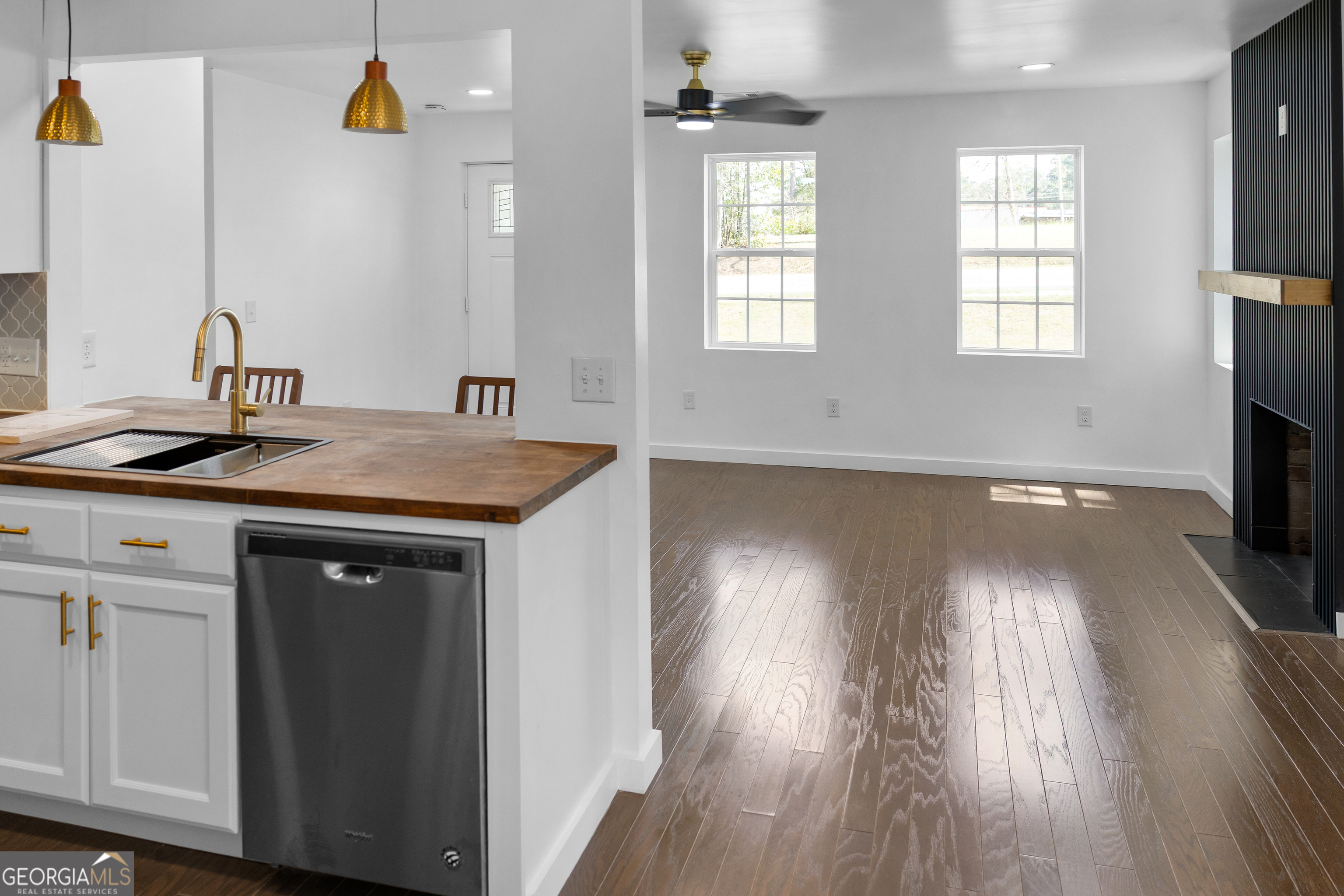 104 Halcyondale Road Sylvania, GA 30467 - Photo 13 of 33 a kitchen with a sink and wooden floor