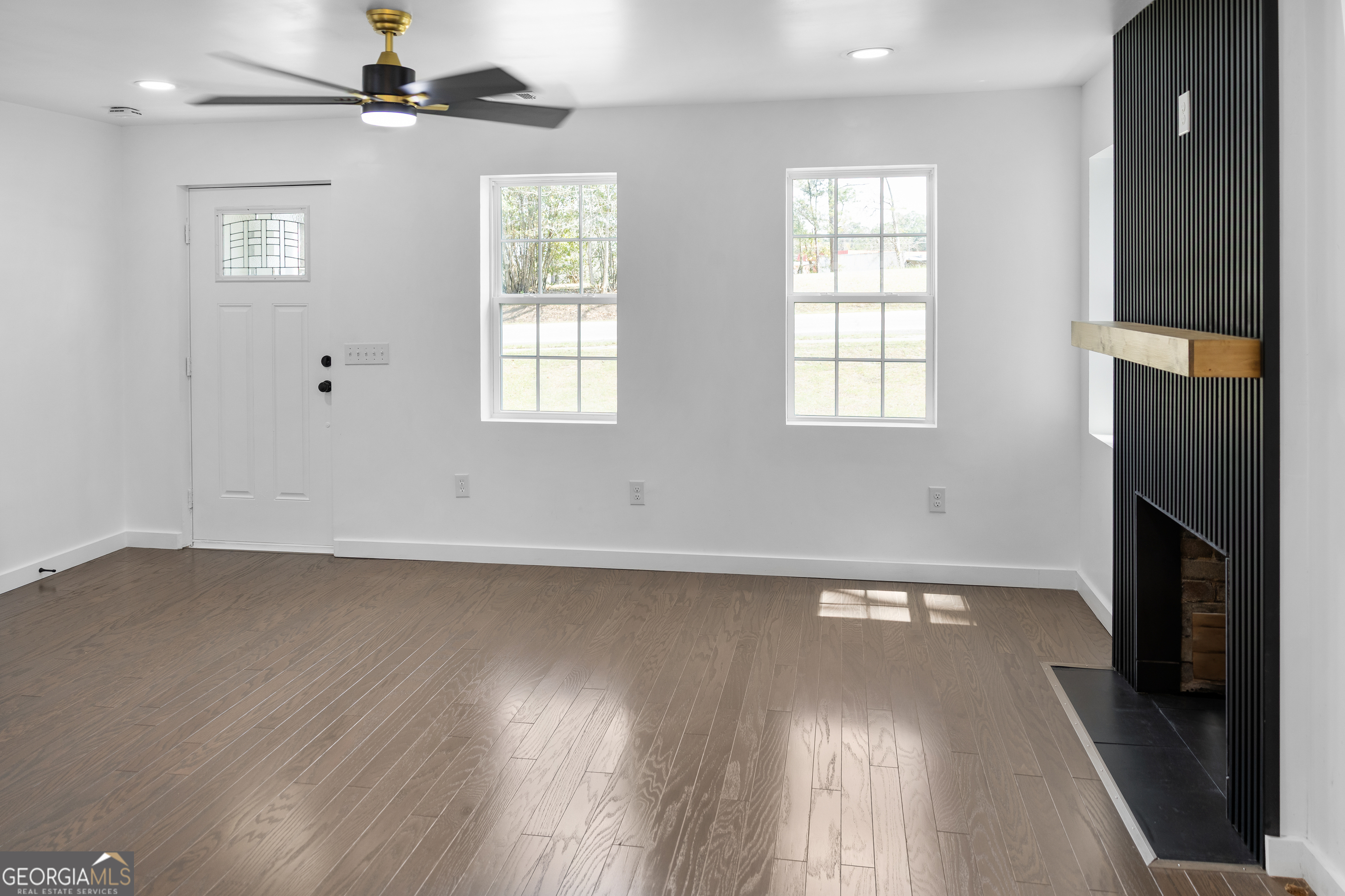 104 Halcyondale Road Sylvania, GA 30467 - Photo 15 of 33 wooden floor in an empty room with a window