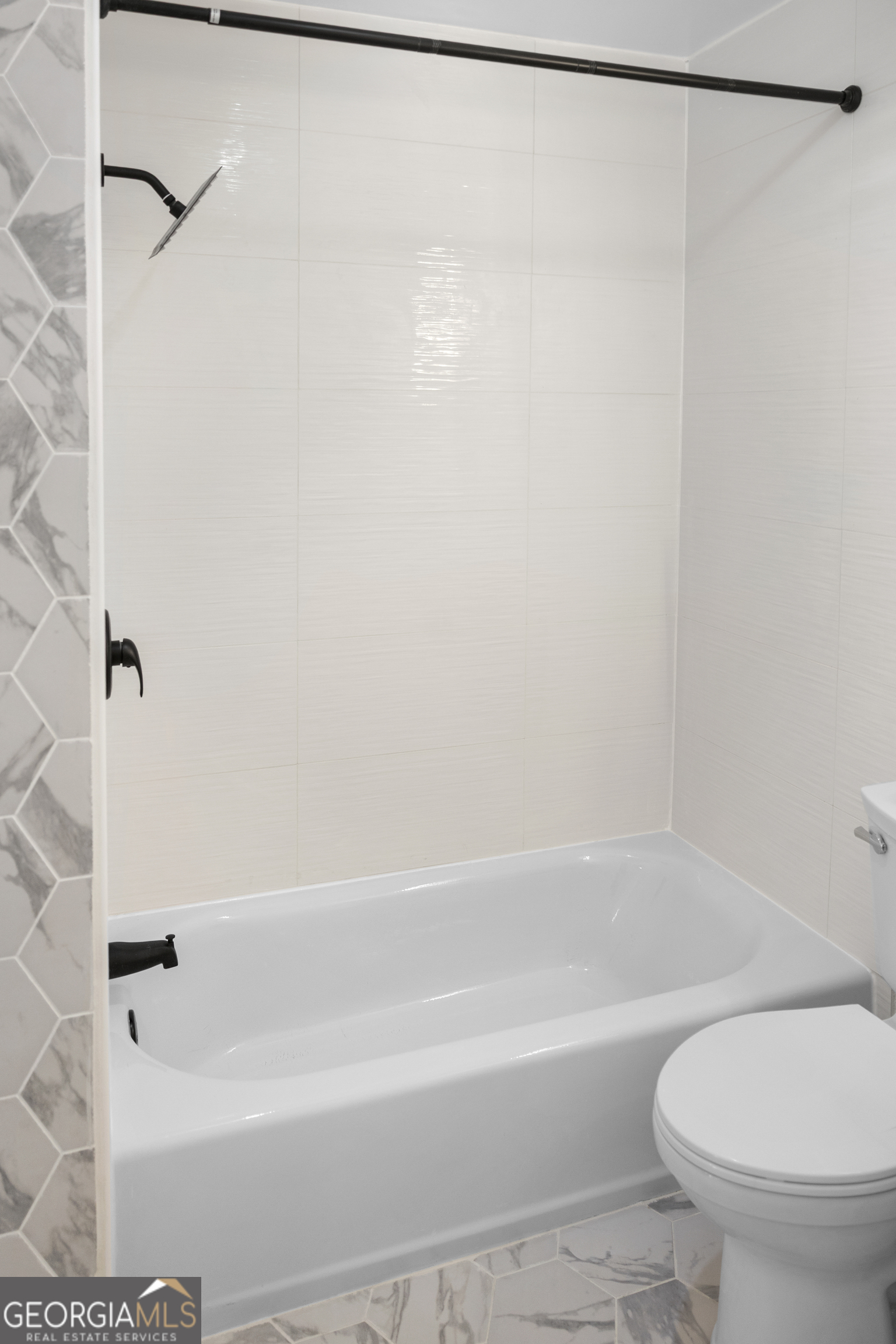 104 Halcyondale Road Sylvania, GA 30467 - Photo 21 of 33 a bathroom with a shower and a white toilet