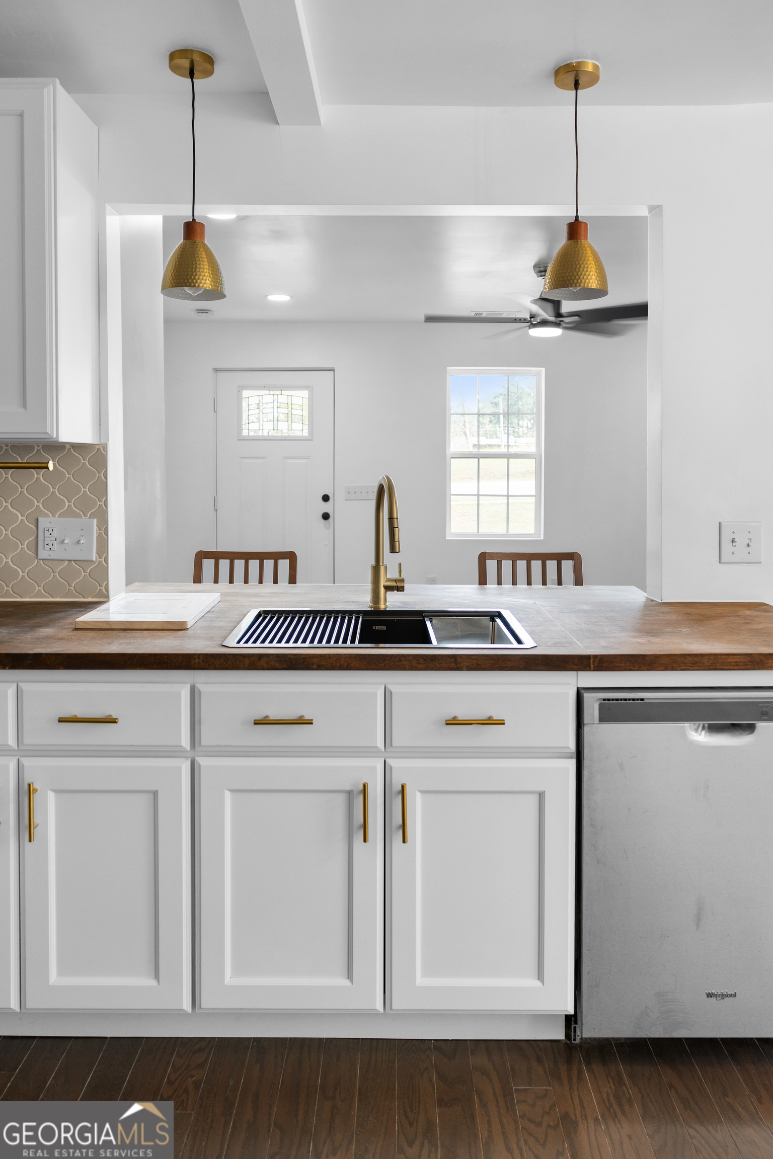 104 Halcyondale Road Sylvania, GA 30467 - Photo 3 of 33 a kitchen with cabinets and chandelier