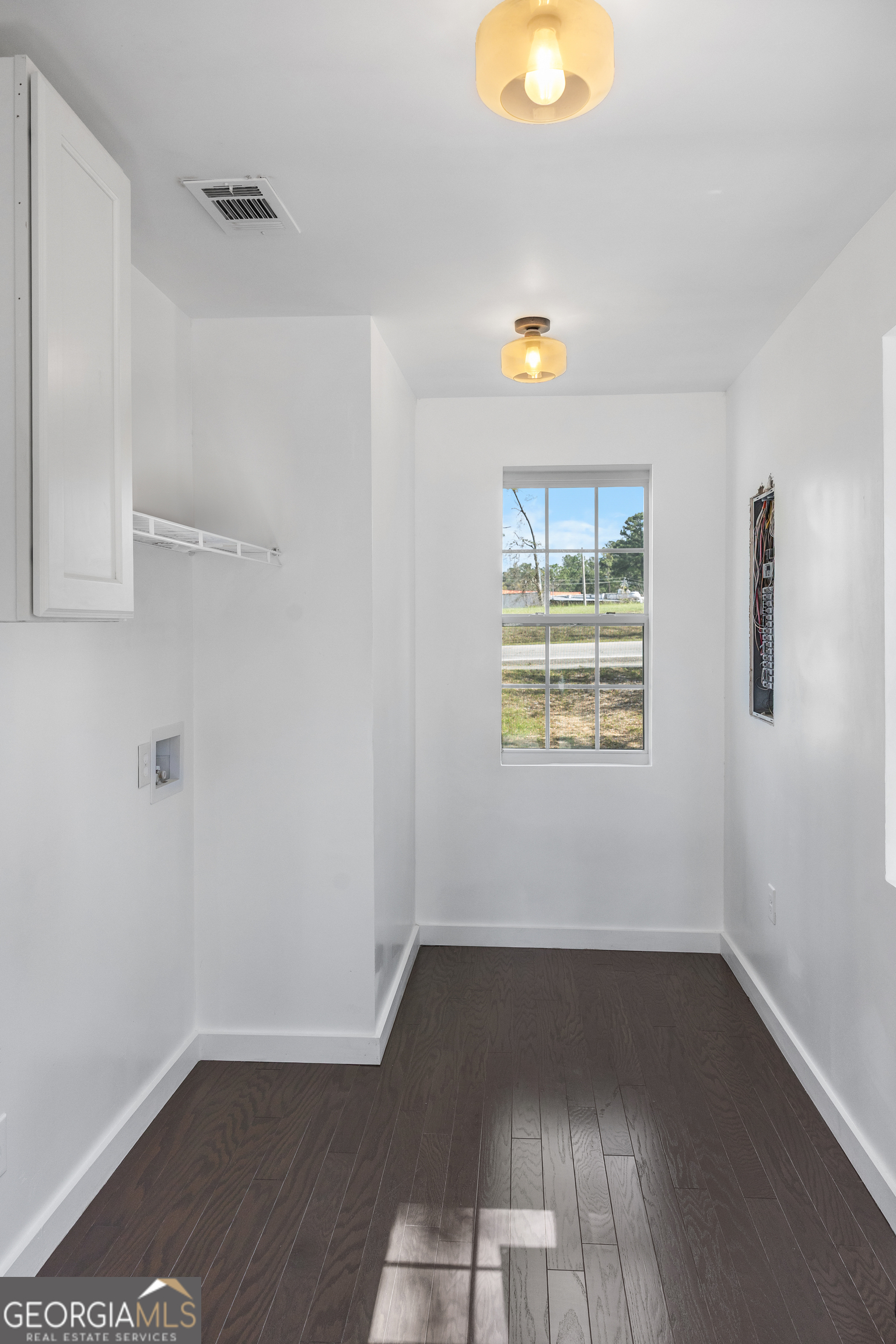 104 Halcyondale Road Sylvania, GA 30467 - Photo 33 of 33 an empty room with wooden floor and windows