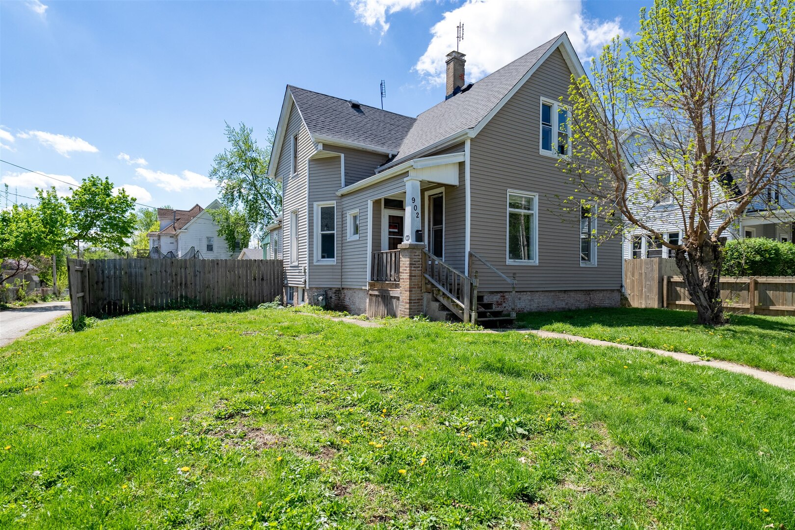 902 West Grove Street Bloomington, IL 61701 - Photo 1 of 17 a front view of house with a garden