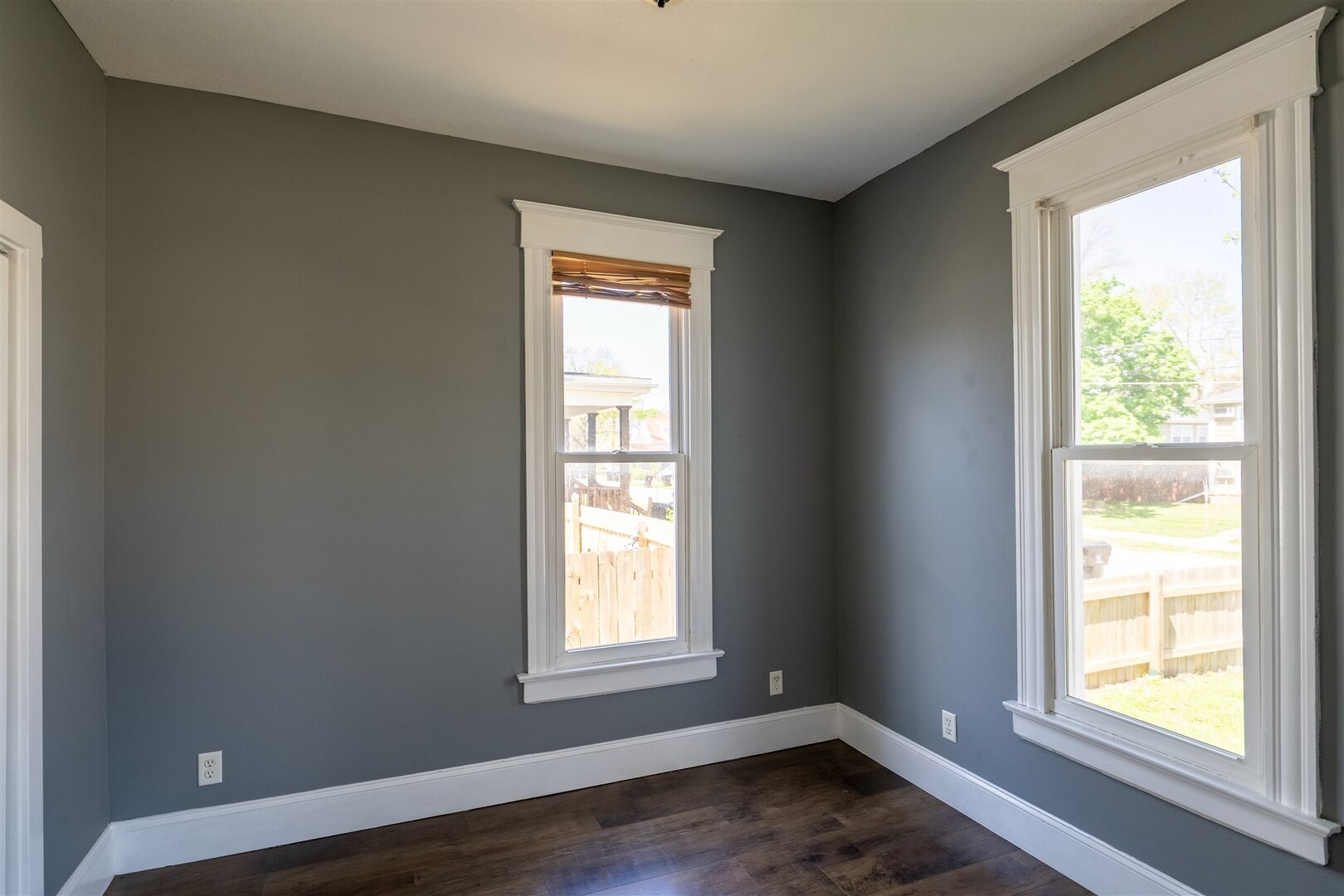 902 West Grove Street Bloomington, IL 61701 - Photo 15 of 17 a view of an empty room with wooden floor and a window