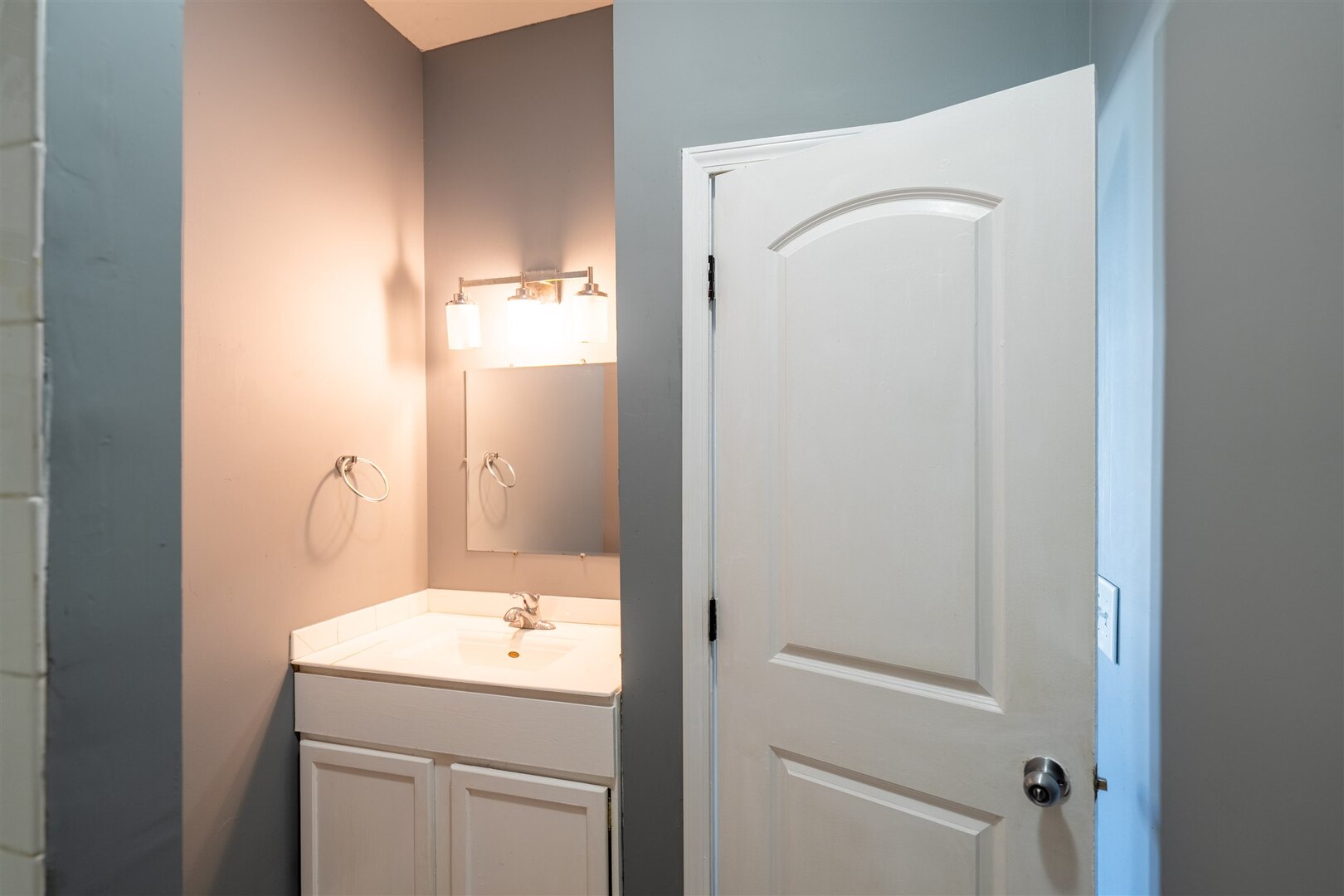 902 West Grove Street Bloomington, IL 61701 - Photo 10 of 17 a bathroom with a granite countertop sink toilet and shower