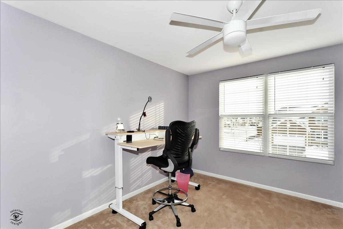 1500 Pine Drive Woodridge, IL 60517 - Photo 20 of 30 a view of a workspace with furniture and a window