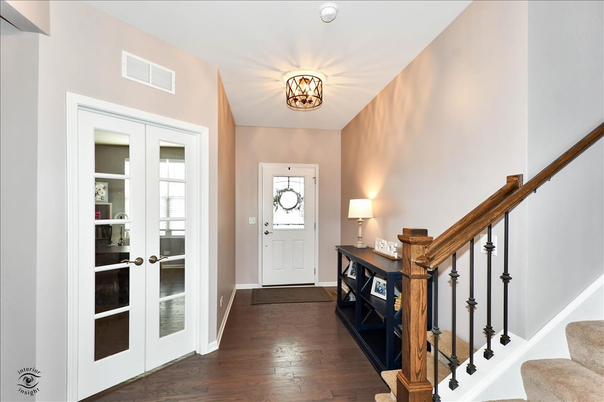 1500 Pine Drive Woodridge, IL 60517 - Photo 4 of 30 a view of an entryway with wooden floor