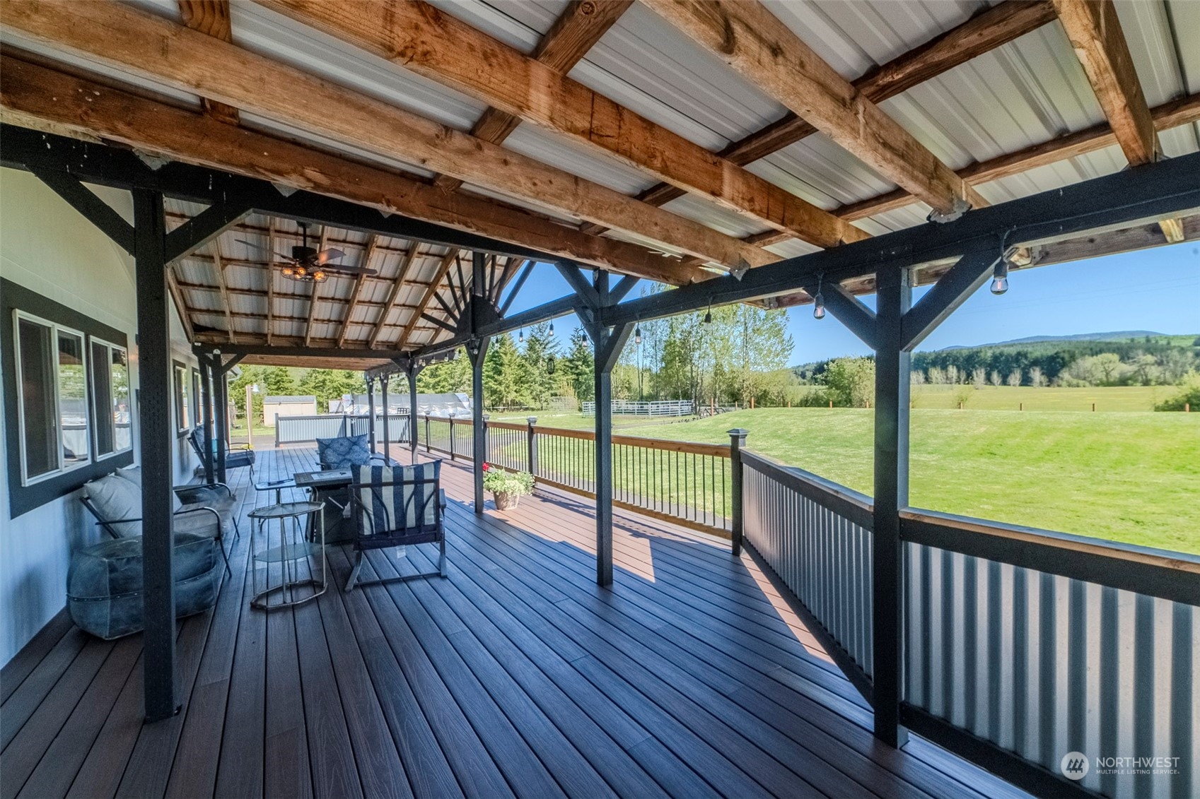 115 Lech Road Chehalis, WA 98532 - Photo 3 of 27 a view of a patio with dining table and chairs