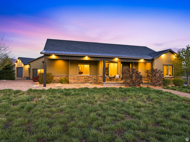 402 Shadow Hill Road Wanship, UT 84017 - Photo 5 of 90 View of front of property with a porch, a yard, stucco siding, and stone siding