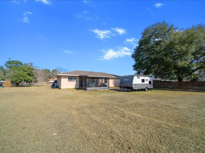 543 Silver Course Court Ocala, FL 34472 - Photo 15 of 21 a front view of a house with a yard and trees