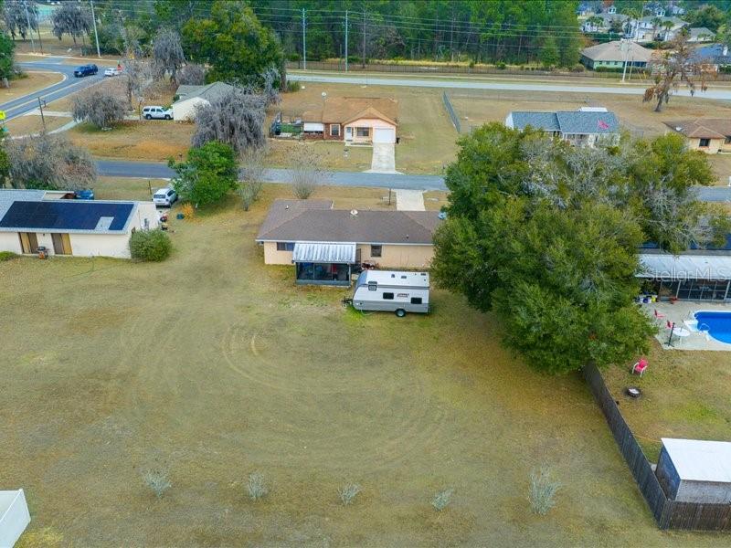 543 Silver Course Court Ocala, FL 34472 - Photo 19 of 21 an aerial view of a house with a yard basket ball court and outdoor seating