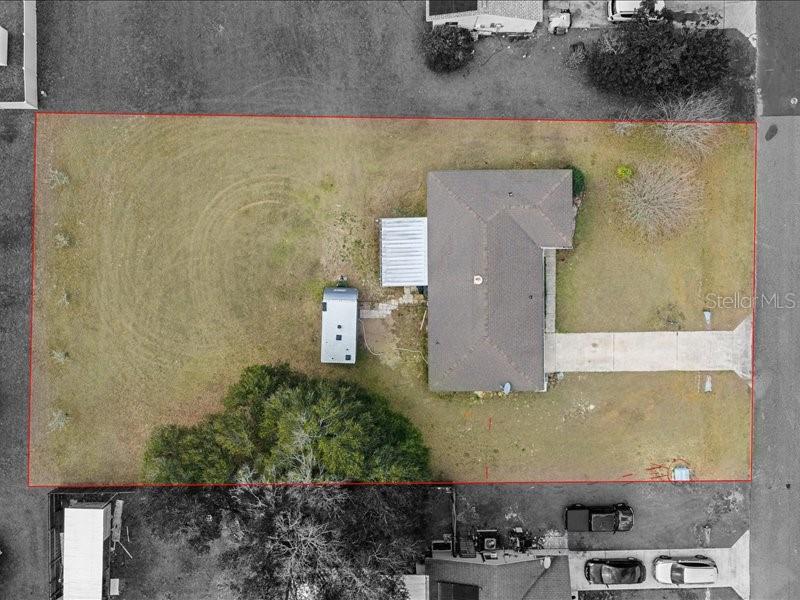 543 Silver Course Court Ocala, FL 34472 - Photo 20 of 21 an aerial view of residential house with pool and yard