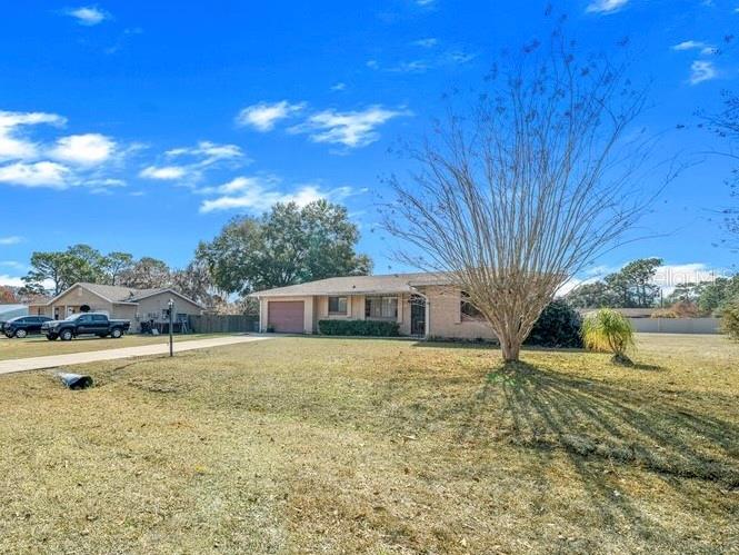 543 Silver Course Court Ocala, FL 34472 - Photo 3 of 21 a house view with swimming pool in front of it