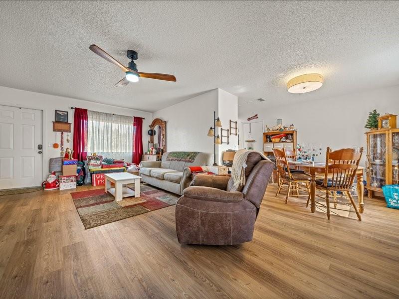 543 Silver Course Court Ocala, FL 34472 - Photo 5 of 21 a living room with furniture and wooden floor