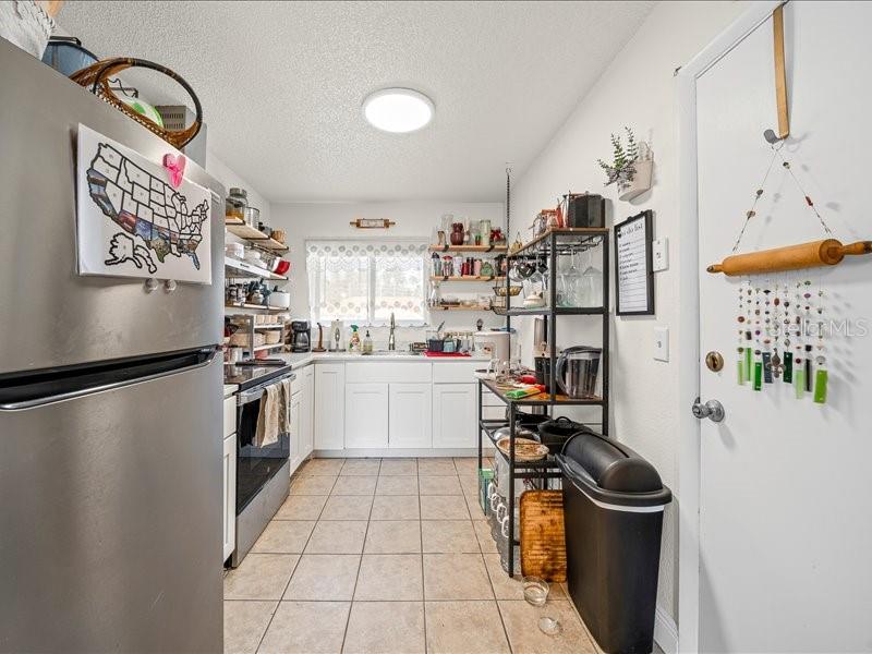 543 Silver Course Court Ocala, FL 34472 - Photo 8 of 21 a kitchen with a refrigerator and a stove