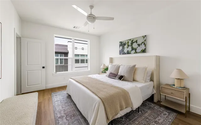 a bedroom with bed and window