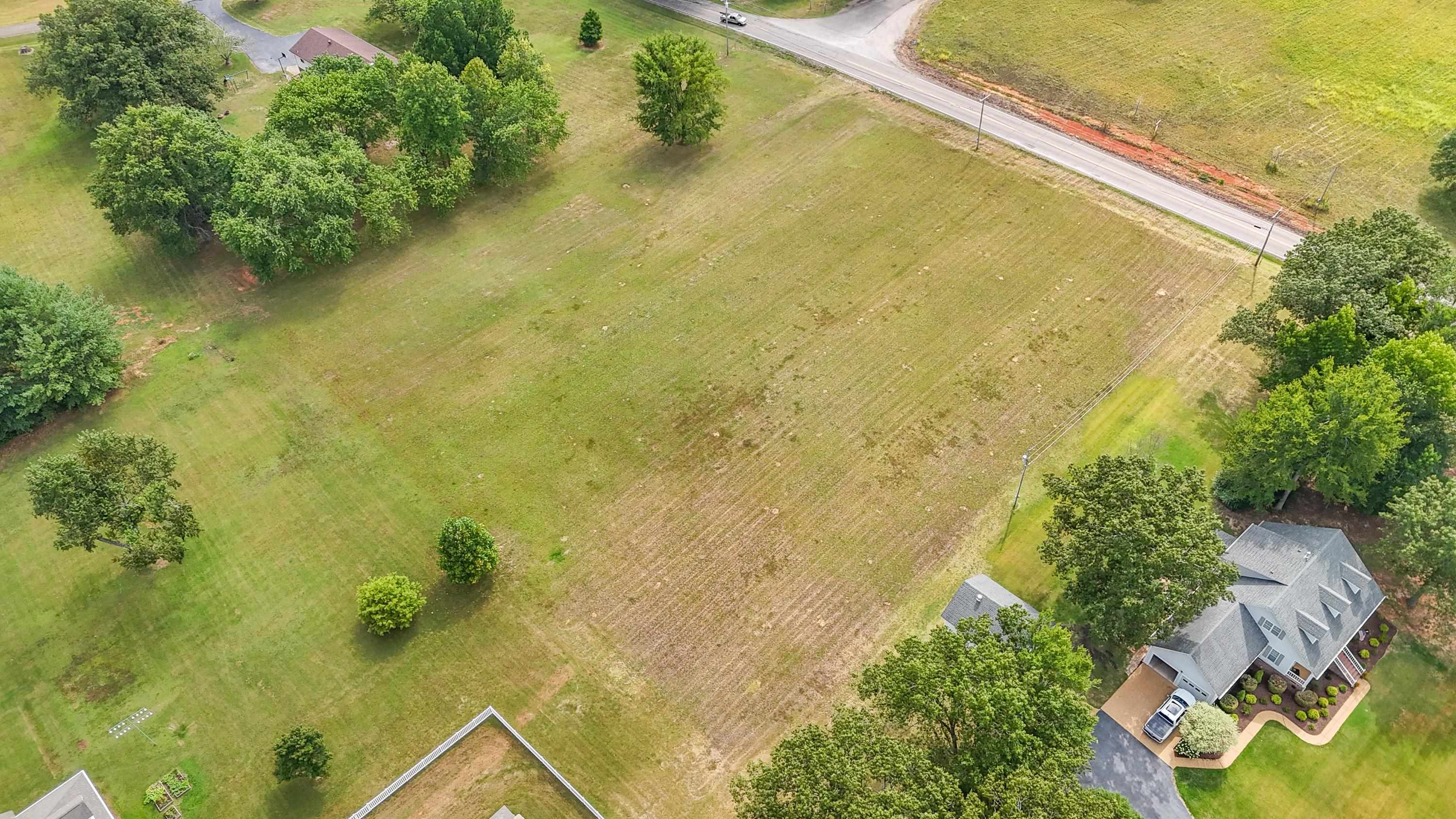 Birds eye view of property featuring a rural view