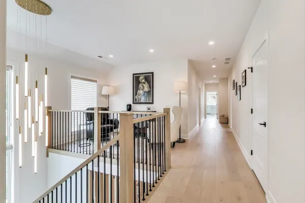 a view of a hallway with windows
