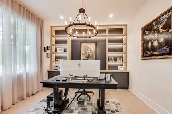 a view of a kitchen area with furniture and chandelier