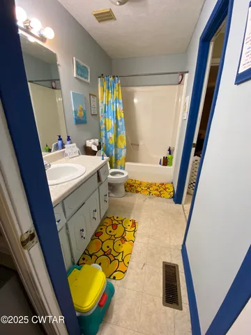 a bed room with a bed and a couch