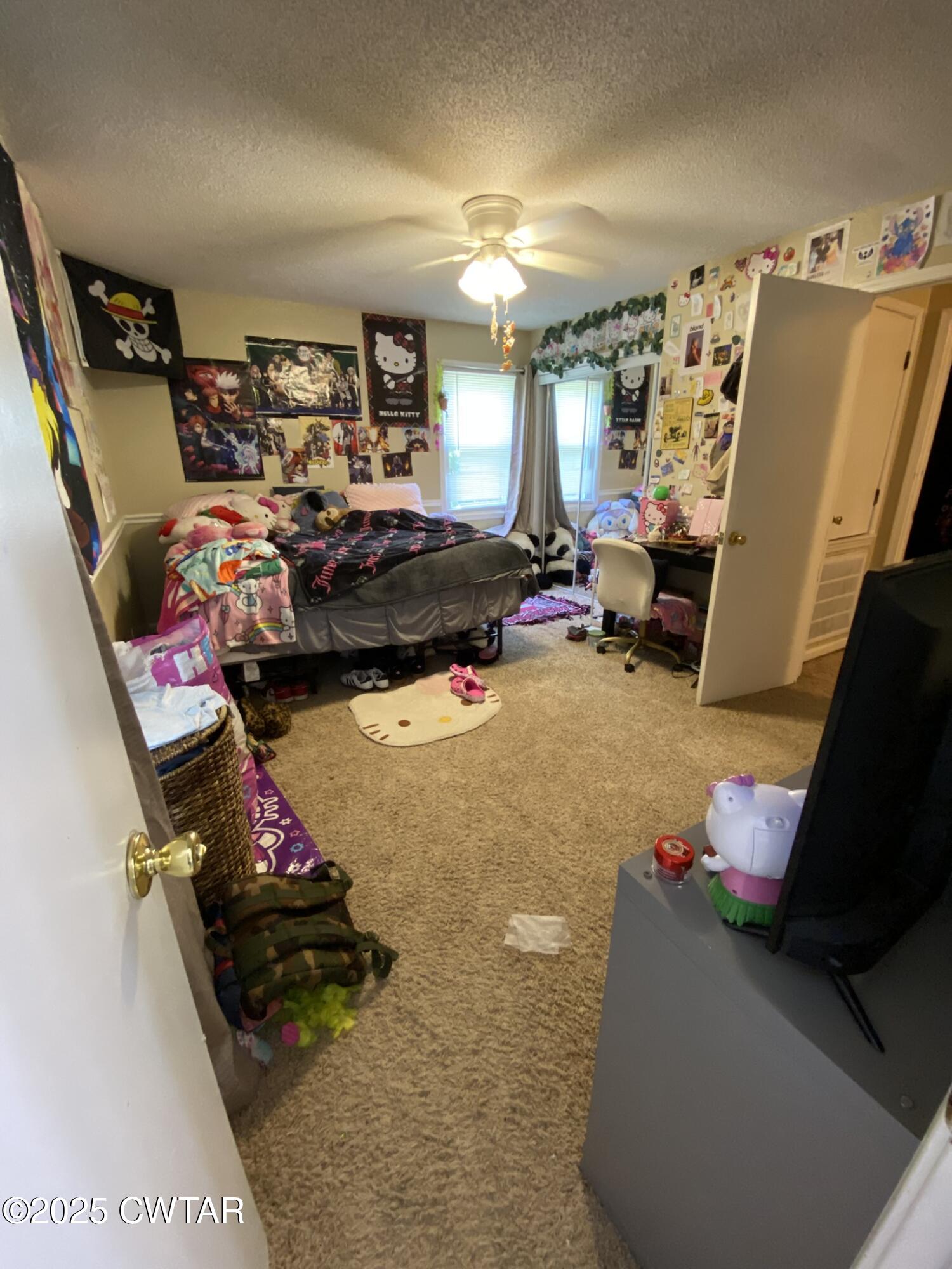 1100 Stewart Road Finger, TN 38334 - Photo 14 of 23 a bed room with a bed and a couch