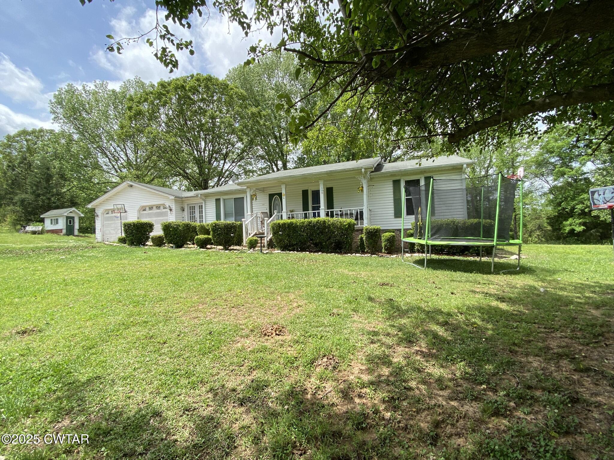 1100 Stewart Road Finger, TN 38334 - Photo 18 of 23 a front view of house with yard and green space