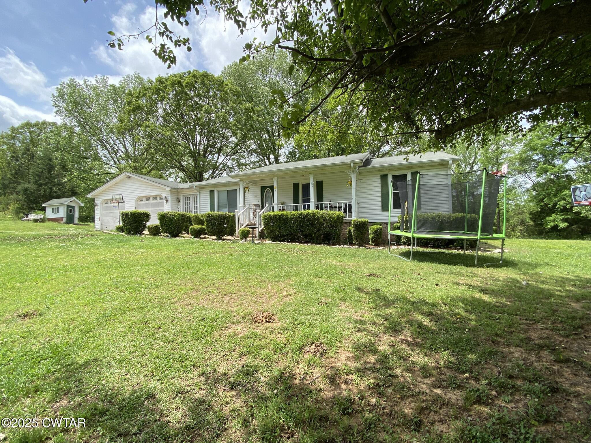 1100 Stewart Road Finger, TN 38334 - Photo 19 of 23 a front view of house with yard and green space