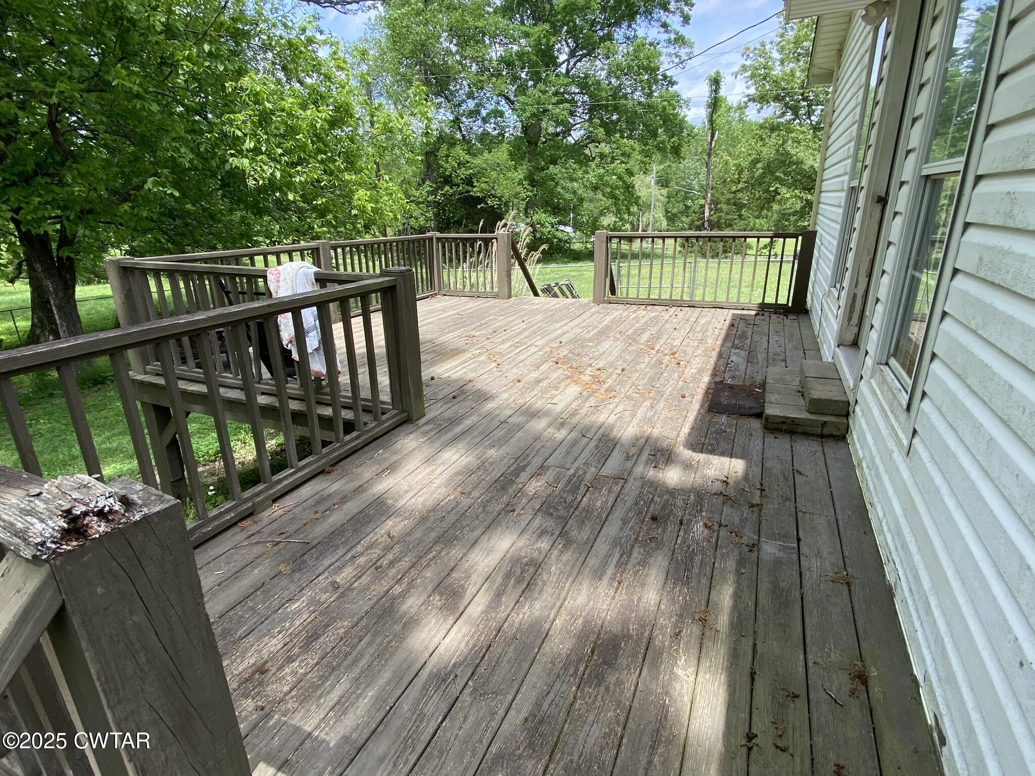 1100 Stewart Road Finger, TN 38334 - Photo 22 of 23 a view of balcony with wooden floor and fence