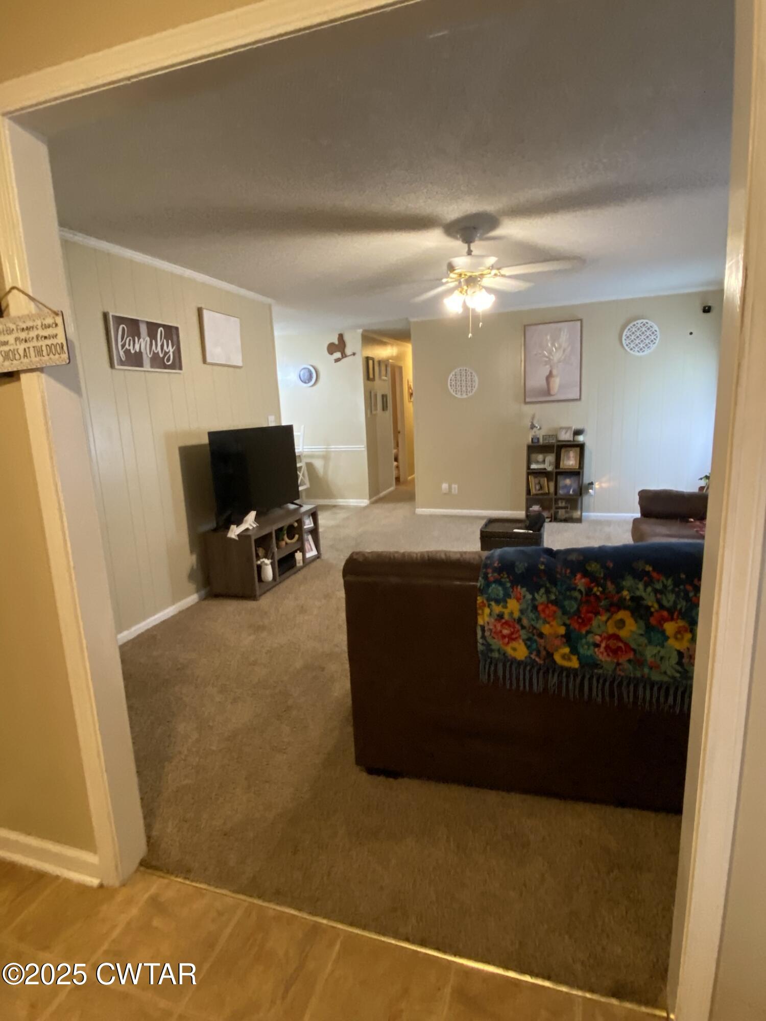 1100 Stewart Road Finger, TN 38334 - Photo 5 of 23 a living room with furniture and a flat screen tv
