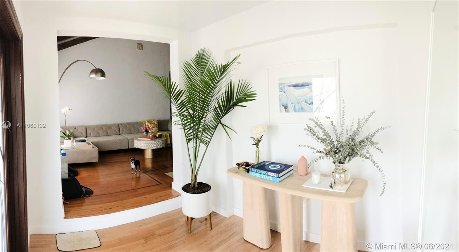 32 Southwest 23rd Road Miami, FL 33129 - Photo 2 of 27 a living room with furniture and a potted plant