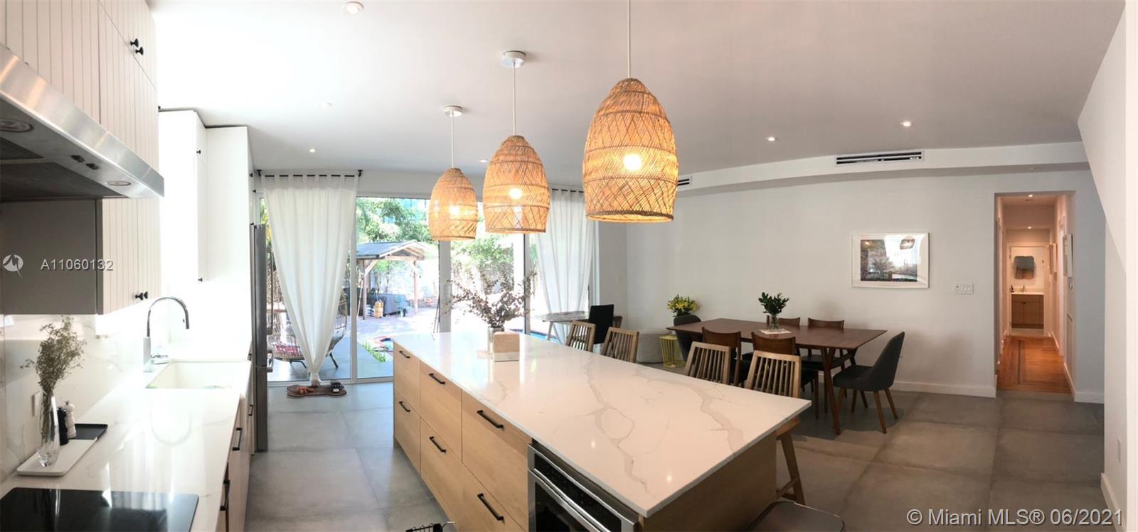 32 Southwest 23rd Road Miami, FL 33129 - Photo 13 of 27 a very nice looking dining room with a large dining table and chairs