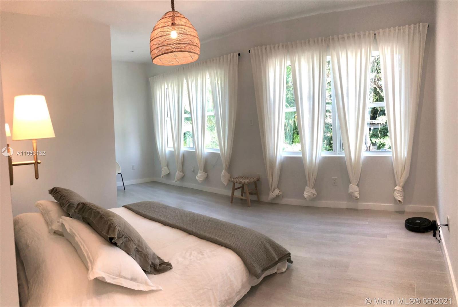 32 Southwest 23rd Road Miami, FL 33129 - Photo 17 of 27 a bedroom with a bed and a window