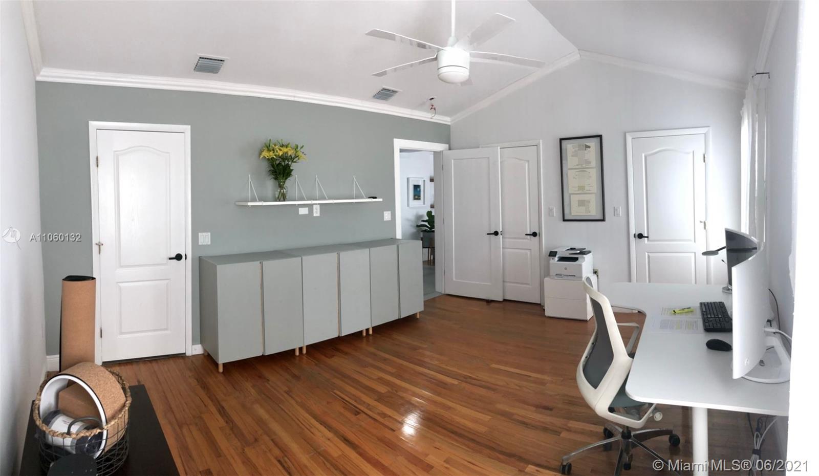 32 Southwest 23rd Road Miami, FL 33129 - Photo 18 of 27 a view of a workspace with furniture and wooden floor