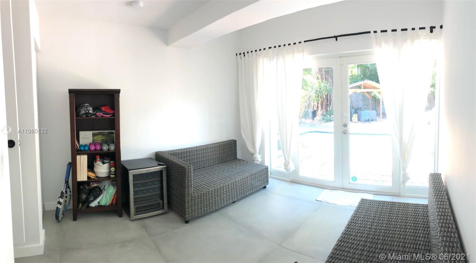 32 Southwest 23rd Road Miami, FL 33129 - Photo 21 of 27 a living room with furniture and a window