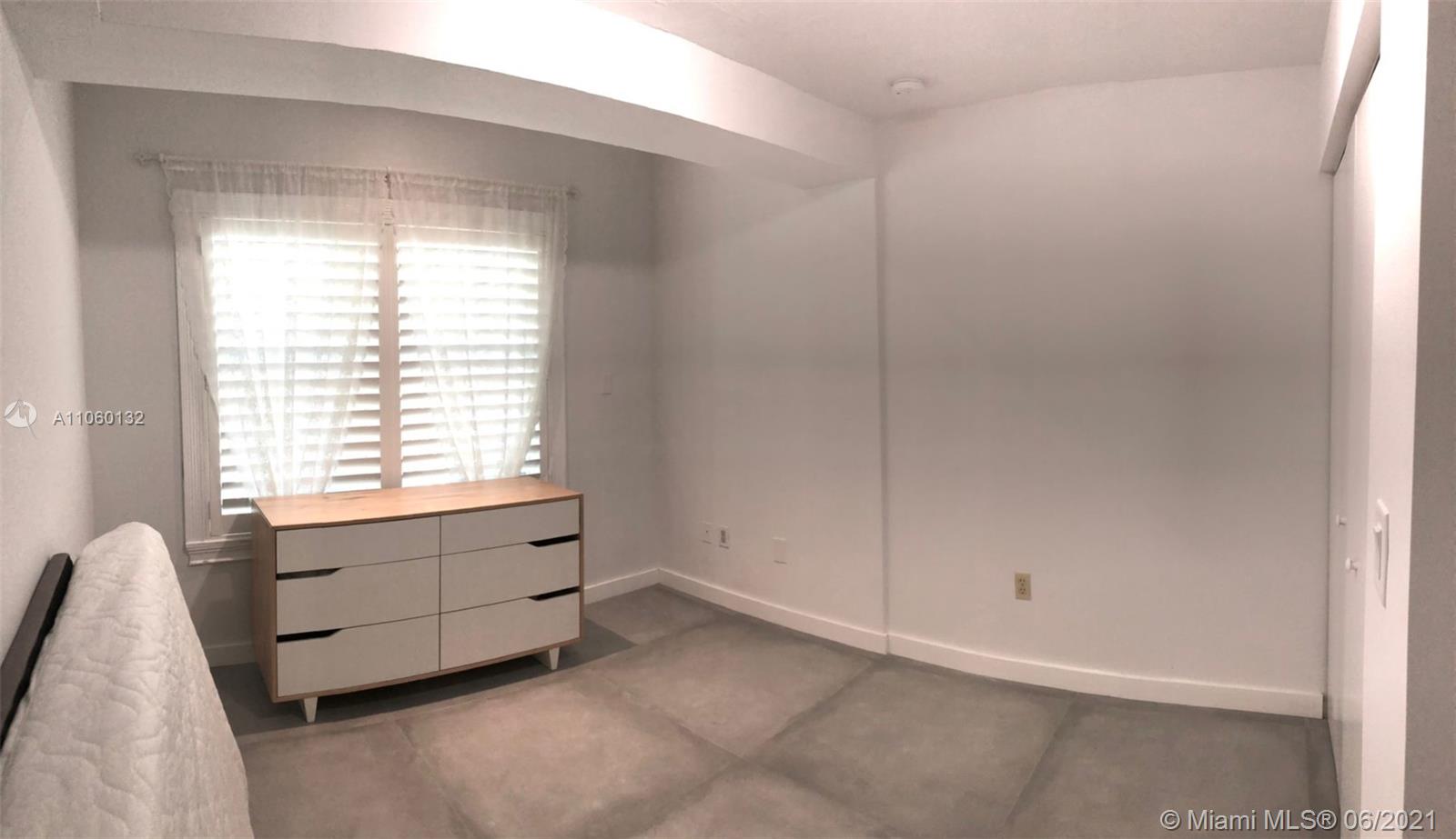 32 Southwest 23rd Road Miami, FL 33129 - Photo 22 of 27 a room with window and a bathroom