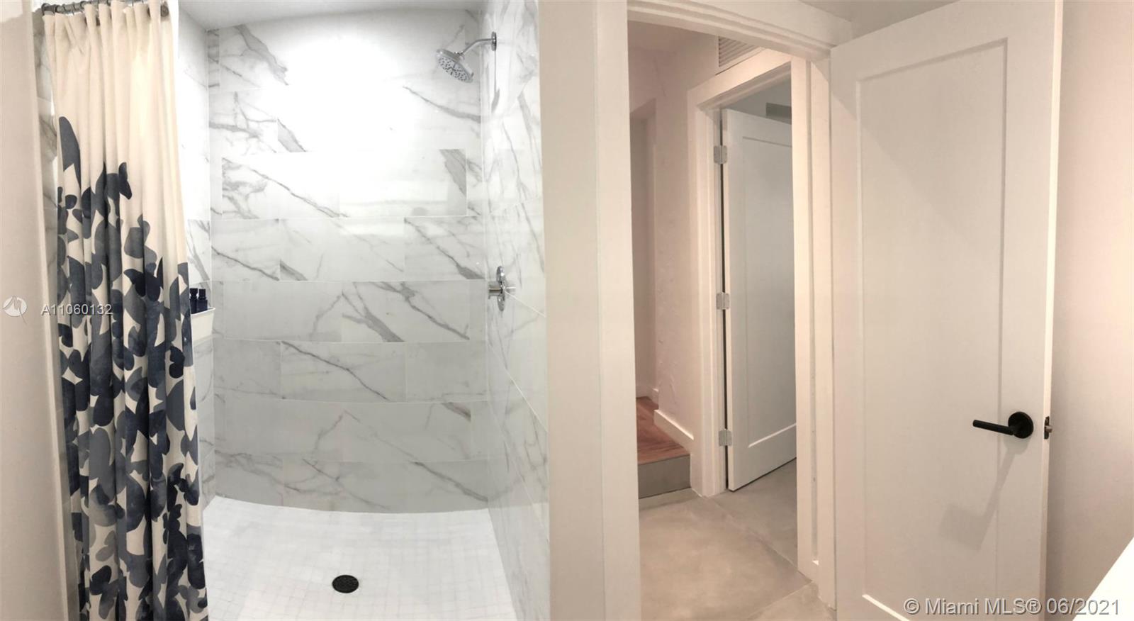 32 Southwest 23rd Road Miami, FL 33129 - Photo 26 of 27 a bathroom with a bathtub