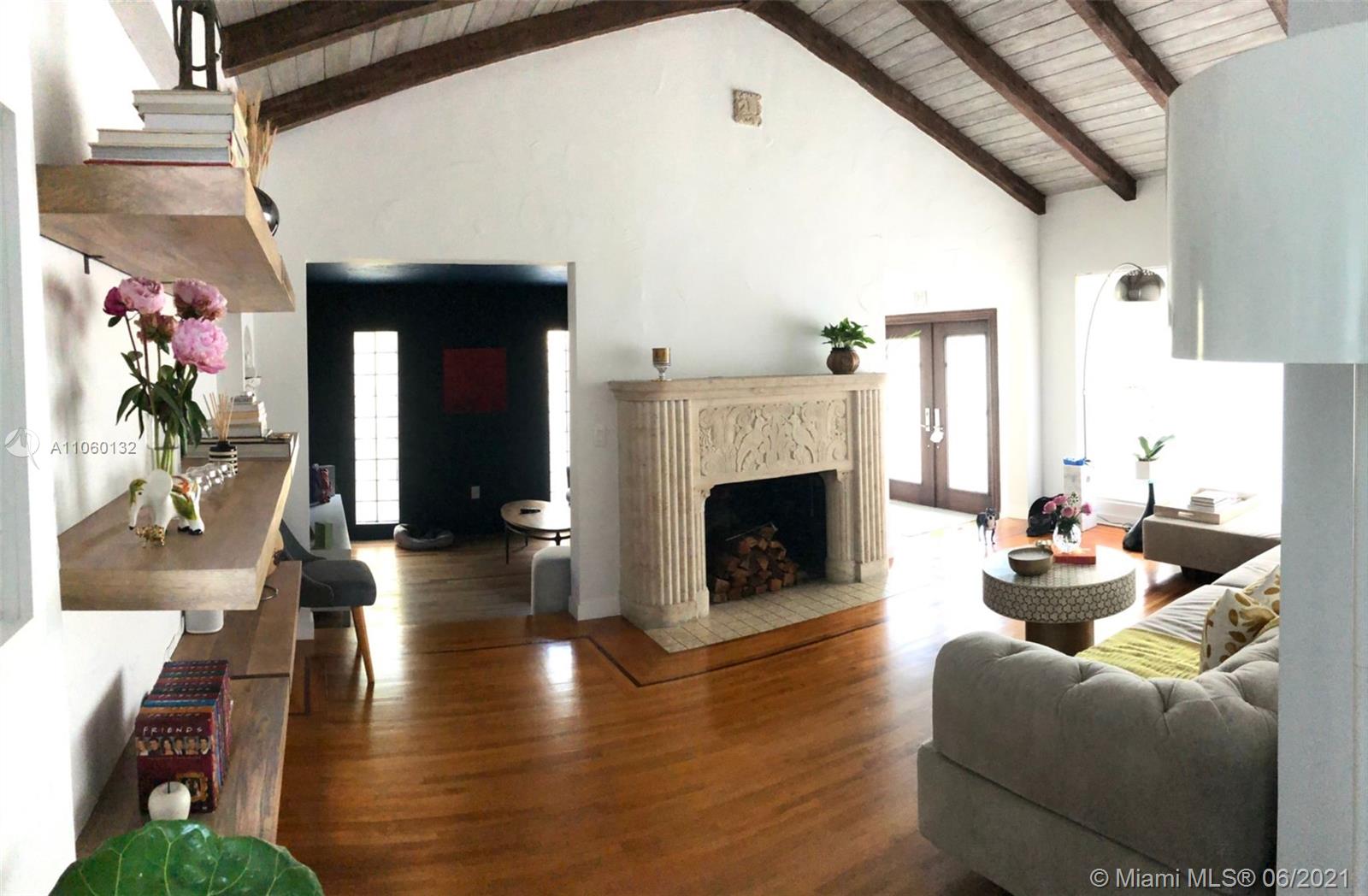 32 Southwest 23rd Road Miami, FL 33129 - Photo 5 of 27 a living room with furniture and a fireplace