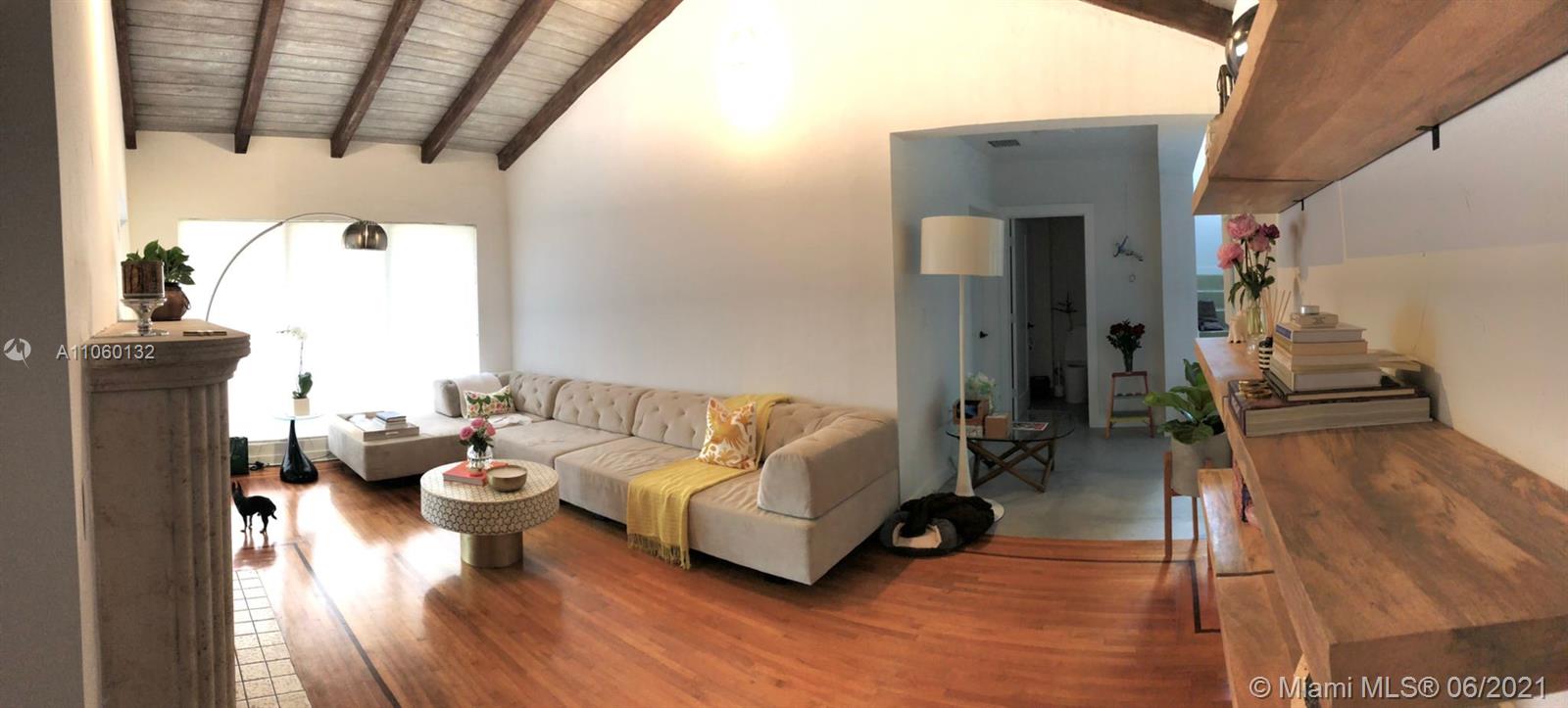 32 Southwest 23rd Road Miami, FL 33129 - Photo 6 of 27 a living room with furniture and a wooden floor