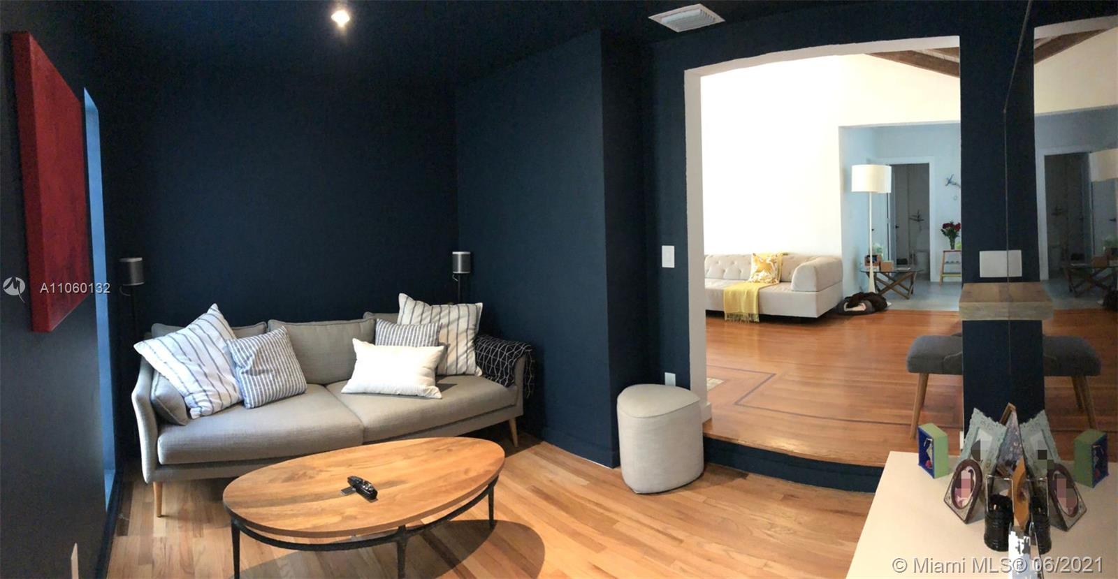 32 Southwest 23rd Road Miami, FL 33129 - Photo 9 of 27 a living room with furniture and a mirror