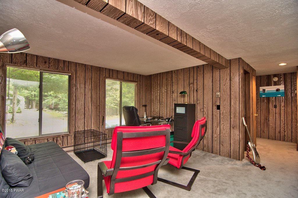 3278 Northgate Road Lake Ariel, PA 18436 - Photo 20 of 40 a living room with furniture a rug and a large window