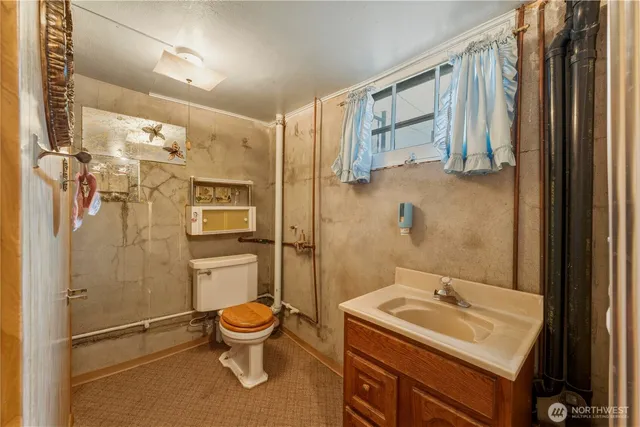 a view of a house with a wooden floor and a yard
