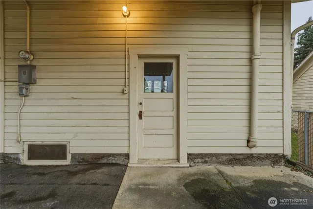a view of an empty room with a fireplace