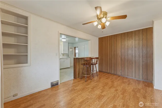 a kitchen with sink cabinets and chandelier