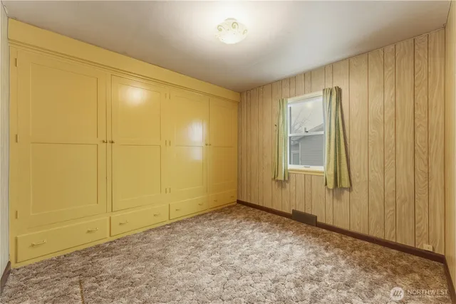 a bathroom with a sink mirror vanity and toilet