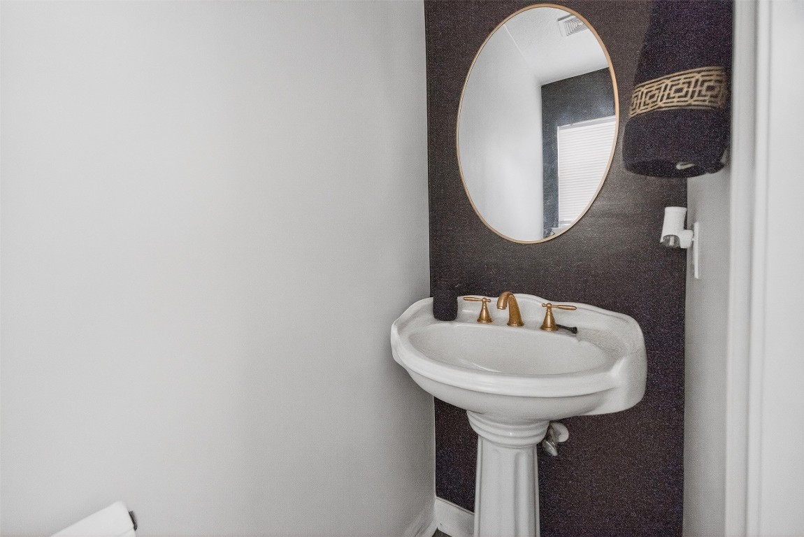 511 Enchanted Lane Spring, TX 77388 - Photo 18 of 38 a bathroom with a sink and a mirror