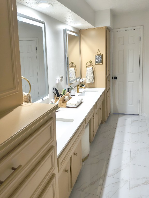 511 Enchanted Lane Spring, TX 77388 - Photo 27 of 38 a bathroom with a double vanity sink a mirror and a bathtub