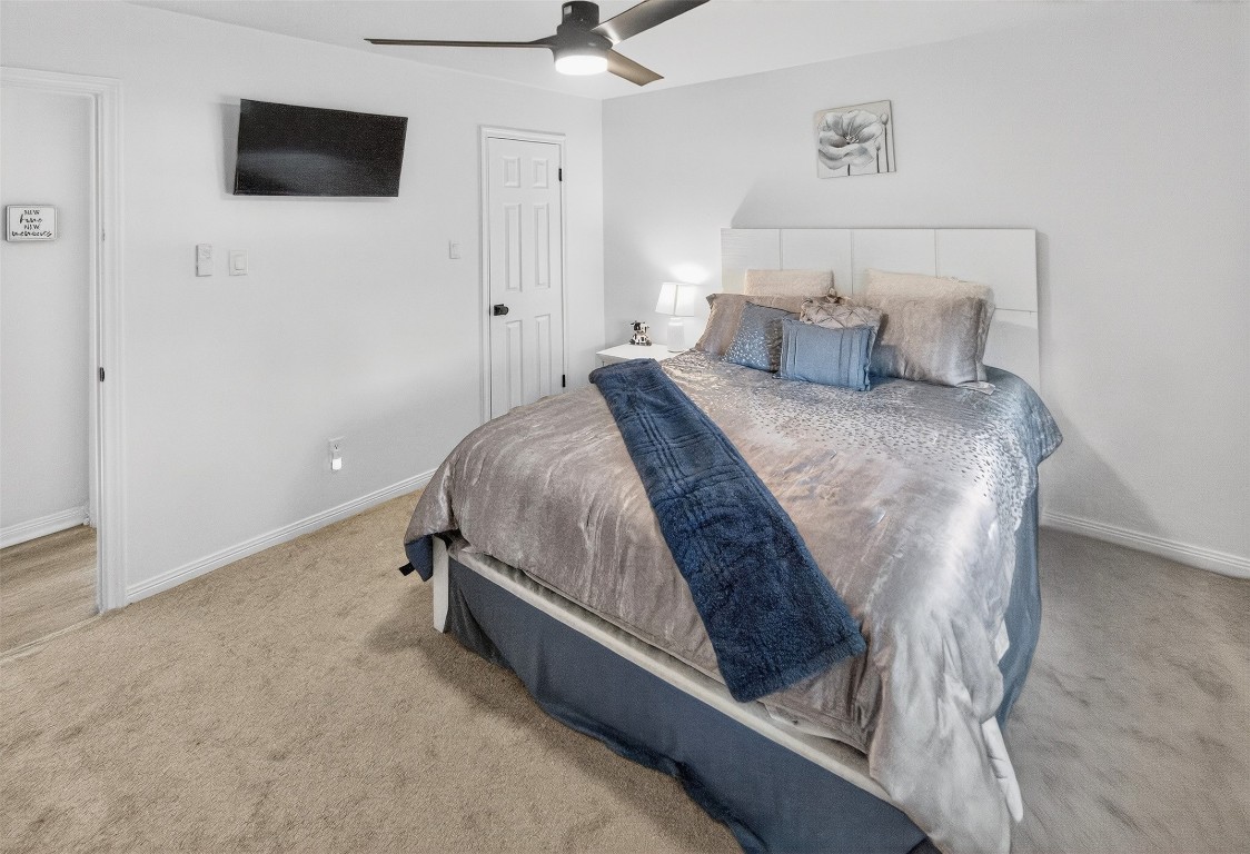 511 Enchanted Lane Spring, TX 77388 - Photo 29 of 38 a bedroom with a bed and a flat screen tv