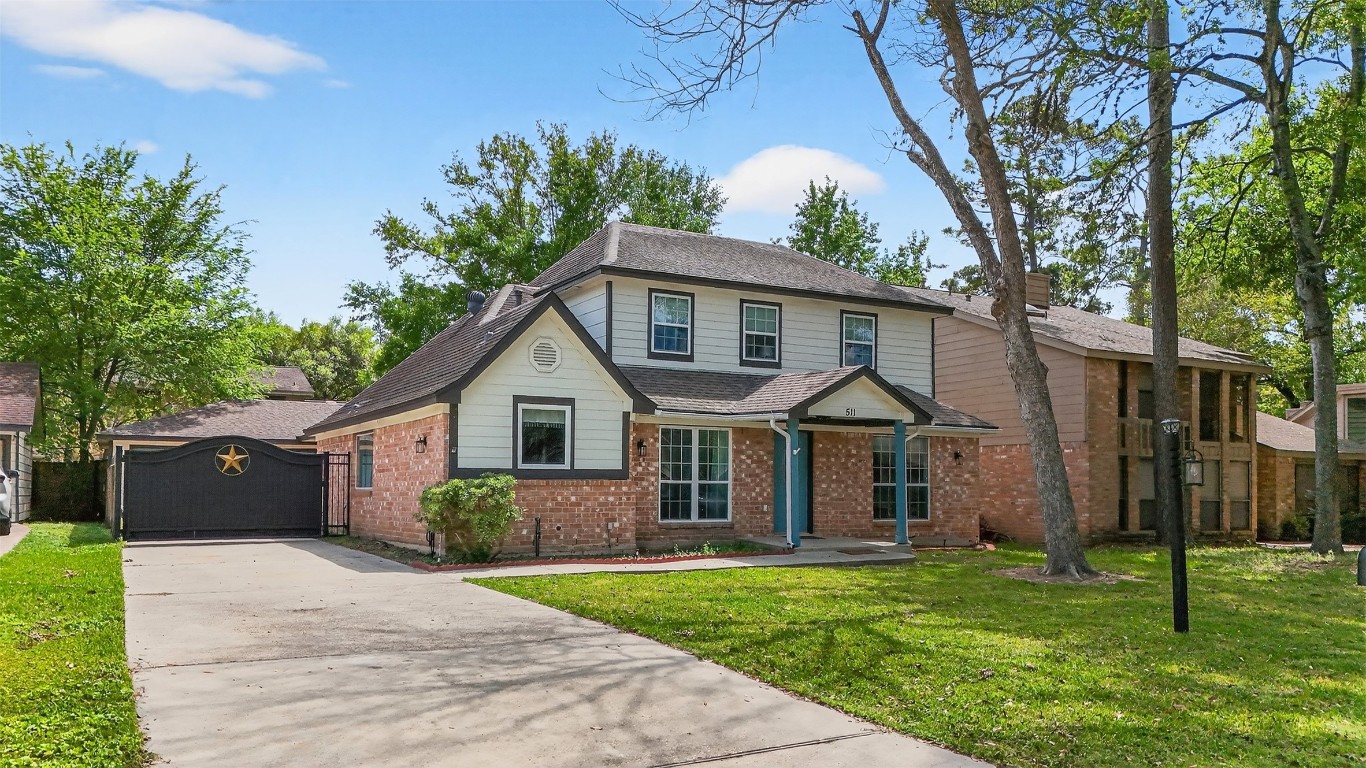 511 Enchanted Lane Spring, TX 77388 - Photo 4 of 38 a front view of a house with a garden