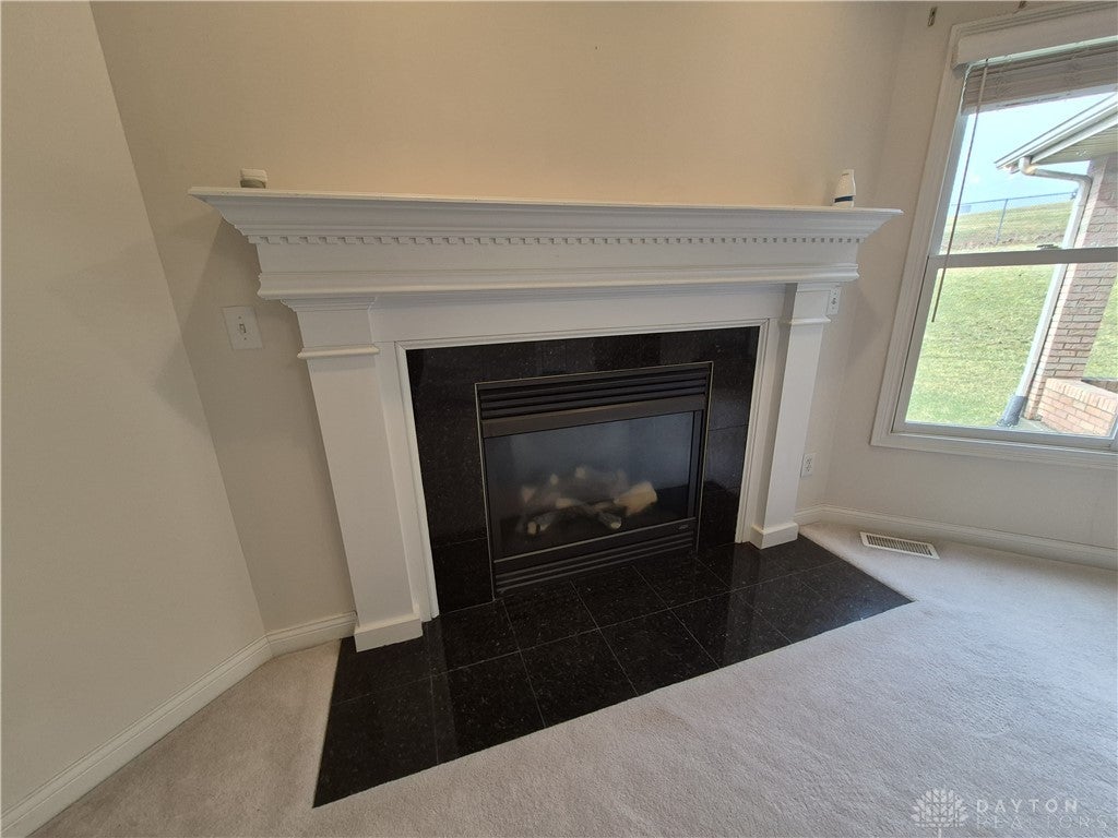 633 Orient Way Hamilton, OH 45013 - Photo 23 of 68 This inviting fireplace creates a focal point for relaxation and warmth.