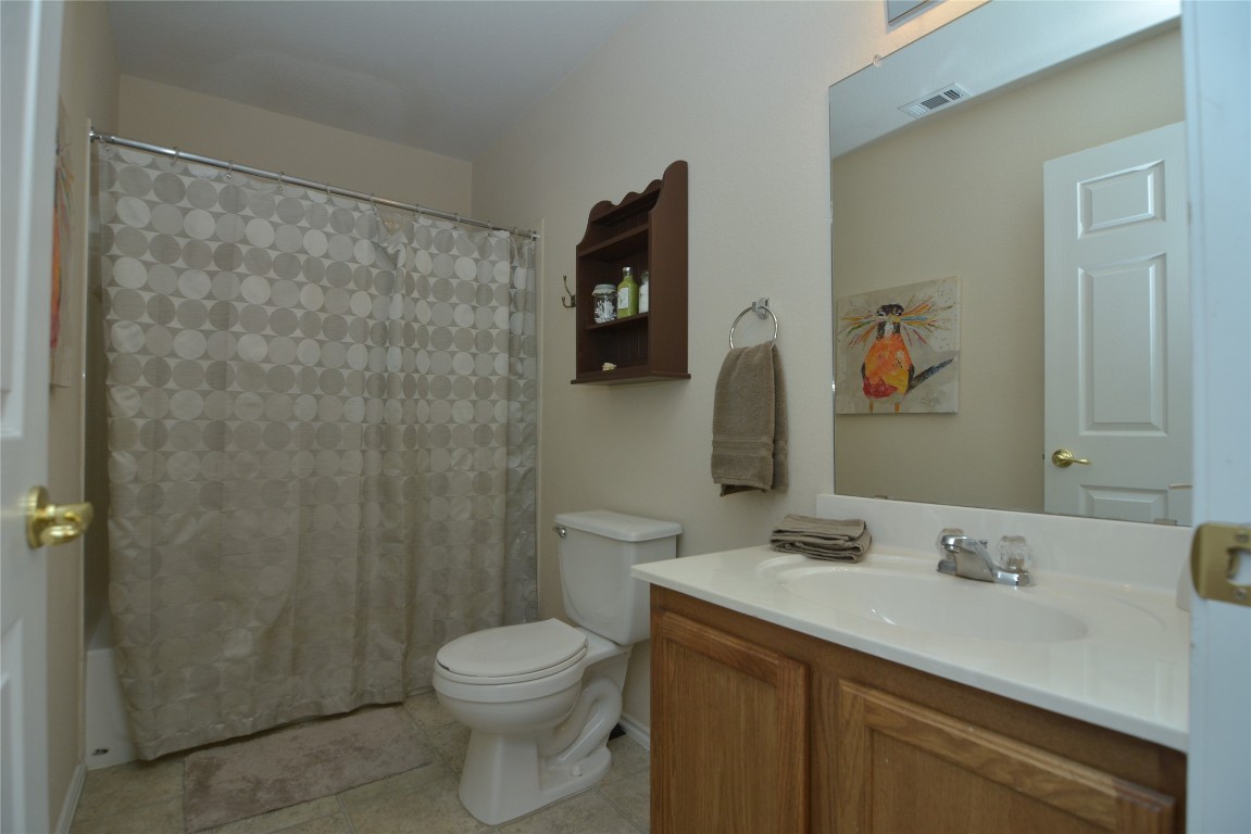 1612 Poppy Seed Lane Austin, TX 78741 - Photo 14 of 18 a bathroom with a sink and a mirror